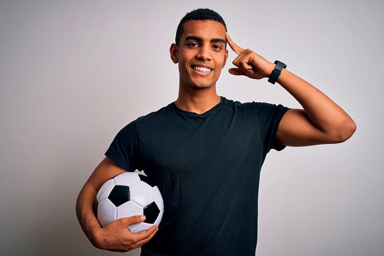 Young man smiling and thinking